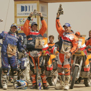 ccr-dakar-2006-bike-category-podium-winner-marc-coma-celebrates-with-cyril-despres-and-gio-2
